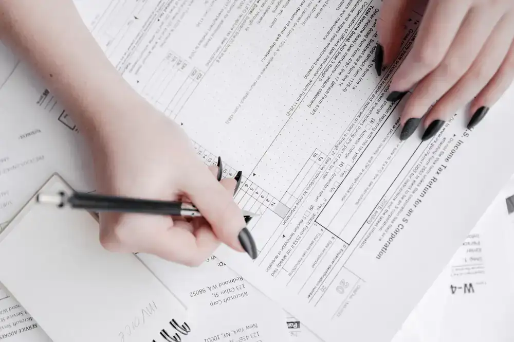 Writing details on an enrollment form