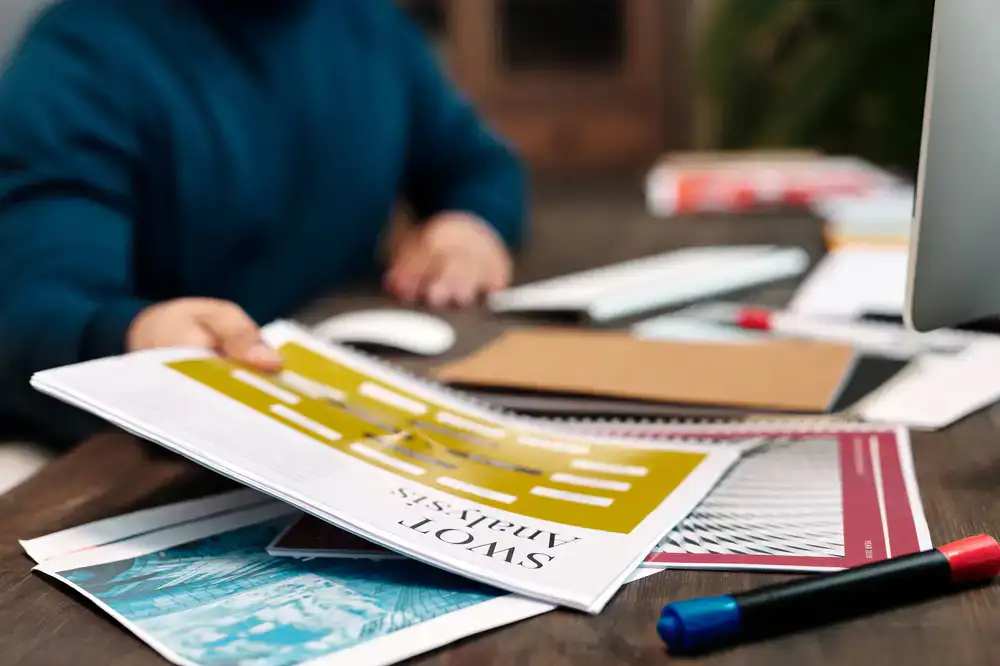 Business language coach reviewing corporate materials